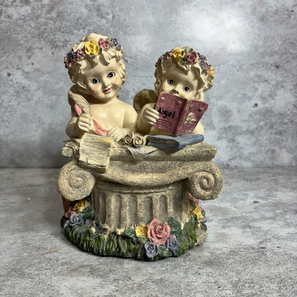 Charming Cherub Figurine with Floral Accents